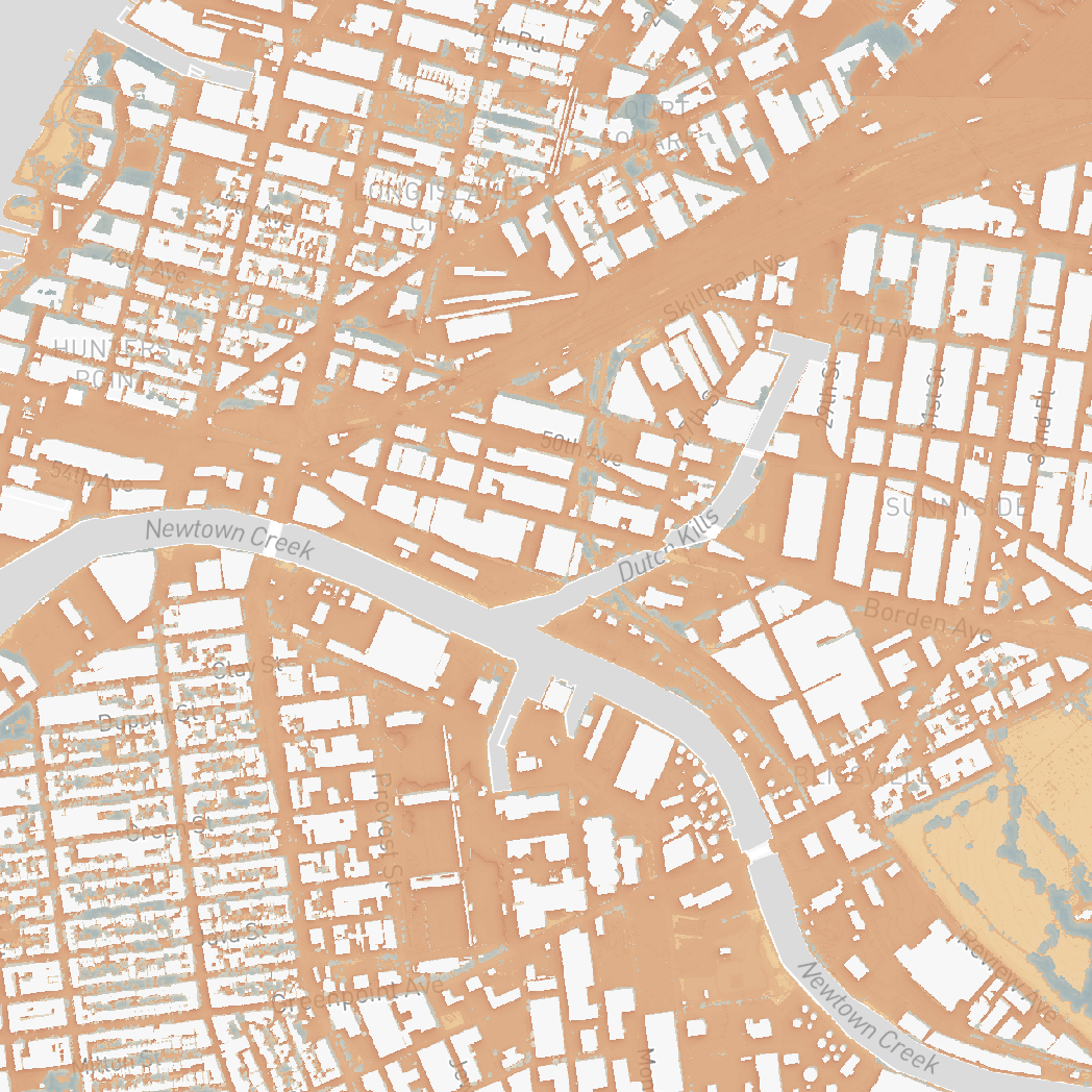 Surface temperature map of Long Island City and Greenpoint, with buildings in white and heat shown in orange